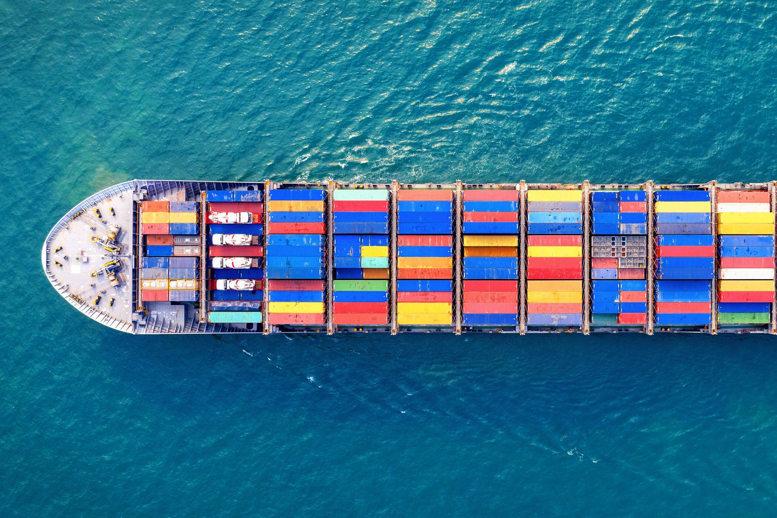 Home aerial view of container cargo ship in sea.