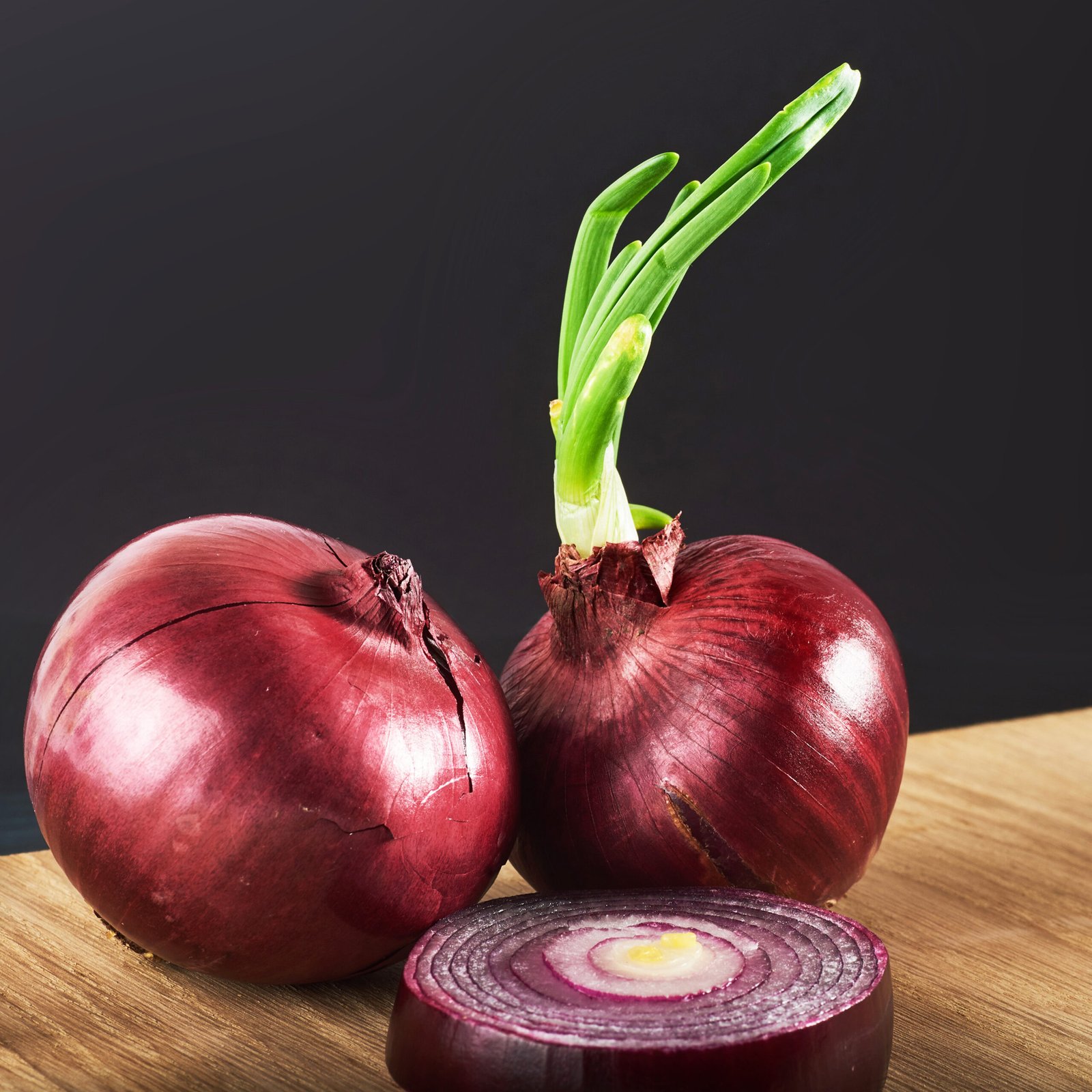 red onions whole, isolated on a black background