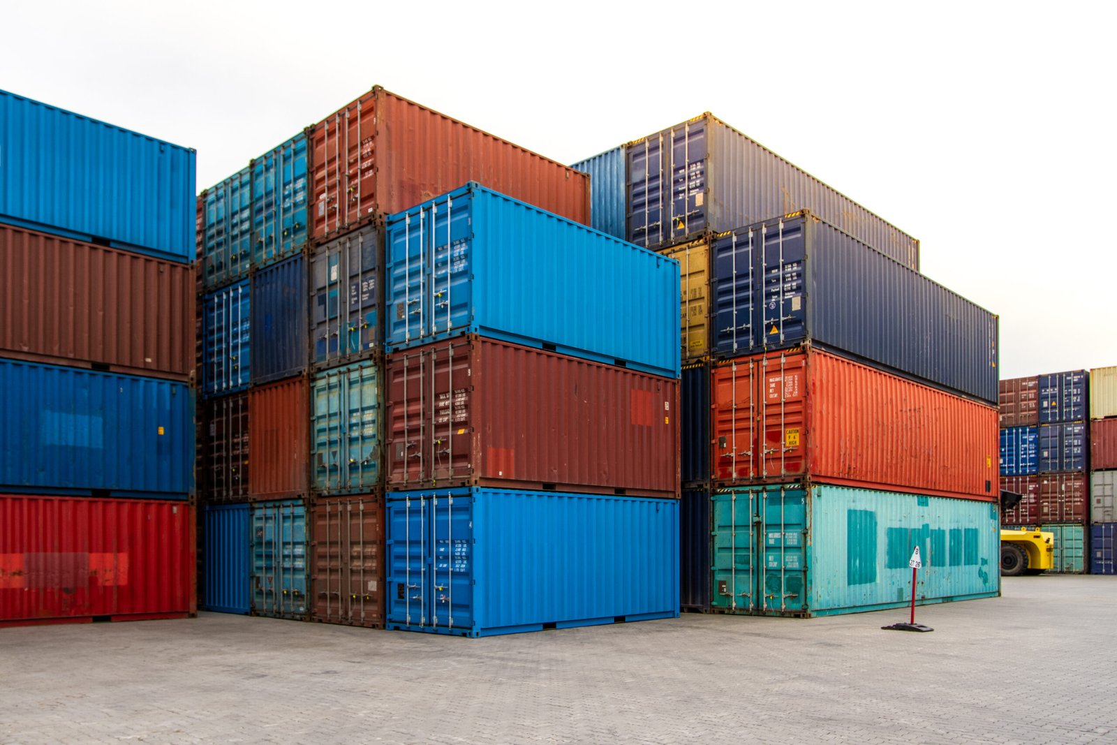 cargo containers. cargo container yard. stack of freight containers at the docks. industrial yard. import and export logistic concept.